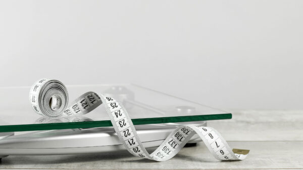 weight-management-tape-measure-on-scale